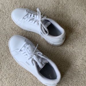 White women’s leather Puma sneakers